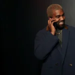 Rapper Kanye West Talks on the Phone Before Attending the Versace Presentation in New York, U.s. December 2, 2018. Reuters/allison Joyce