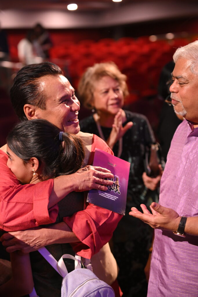 Datuk Seri Vijay Eswaran, Founder and Executive Chairman of QI Group and Datuk Seri Ramli Ibrahim (hugging one of his students) exchanging a light moment after the performance of Kala Vriksha at the Temple of Fine Arts where the initiative by RYTHM Foundation was announced.