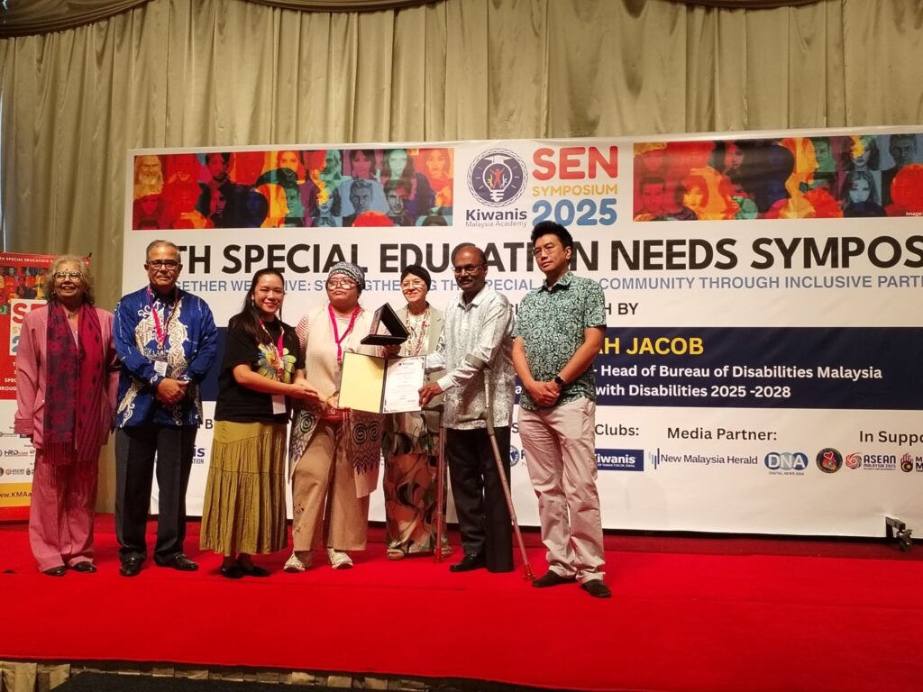 Nakseni | Nmh Nakseni, One of the Partners for Sen Symposium 2025 Receiving Their Plaque and Certificate from the Organisers and Senator Isaiah Jacob