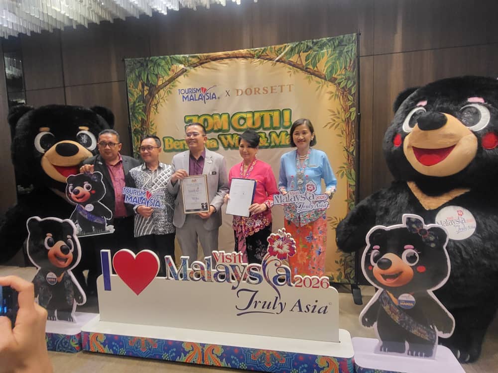 Muhammad Amirul Rizal Abdul Rahim of Tourism Malaysia and Dorsett's Datin Jasmine Heng pose with the Visit Malaysia mascots Wira and Manja during the launch of Dorsett Hotels Malaysia's immersive family-themed room experience.