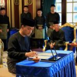 Datuk Onn Hafiz Ghazi Signs the Instrument of Appointment After Being Sworn in As Johor Menteri Besar Following Barisan Nasional's Decisive Victory in the Johor State Election.